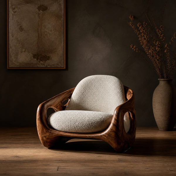 Sculpted Lounge Chair With Oval Side Cutouts And Cream Cushions