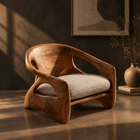 Sculpted wood chair with oval back cutouts and a cushioned seat, three-quarter view showing the grain