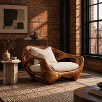 Sculpted lounge chair with an open hollowed wood frame and low base in an industrial loft living room with exposed brick