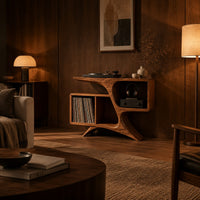 Sculpted wood record console with swooping legs and open bays in an evening living room with walnut wall paneling
