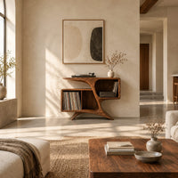 Sculpted wood record console with swooping legs and open bays in a bright open plan living room