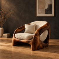 Low shell chair with thick wooden sides and oval side openings in a dark studio against a charcoal plaster wall