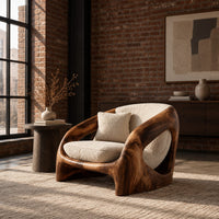 Low shell chair with thick wooden sides and oval side openings in an industrial loft living room with exposed brick