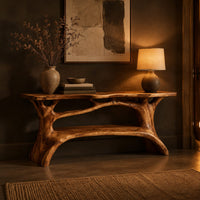 Shoe bench with a slab top, root style supports and an open shelf in a dark entryway at golden hour