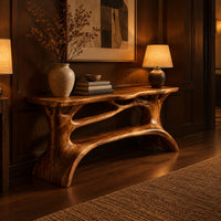 Shoe bench with a slab top, root style supports and an open shelf in an evening entryway with walnut wall paneling