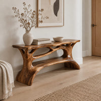 Shoe bench with a slab top, root style supports and an open shelf in a Scandinavian entryway with white walls