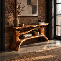 Shoe bench with a slab top, root style supports and an open shelf in an industrial loft entryway with exposed brick