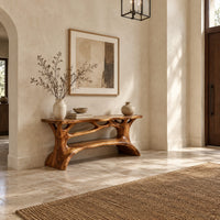 Shoe bench with a slab top, root style supports and an open shelf in a bright open plan entryway