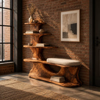 Sculpted wood shoe bench with a cushioned seat and a tower of shelves in an industrial loft entryway with exposed brick