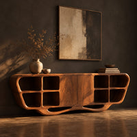 Sculpted sideboard with open cubbies and a flowing wave base, three-quarter view showing the grain