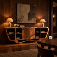 Sculpted sideboard with open cubbies and a flowing wave base in an evening dining room with walnut wall paneling