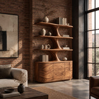 Bookshelf with wavy shelves on a sculpted stem and a three door base in an industrial loft living room with exposed brick