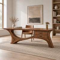 Long desk with sculpted swooping legs and a two drawer unit under the top in a Scandinavian home office with white walls