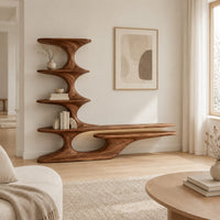 Sculpted tv stand with a stacked shelf tower and a long low ledge in a Scandinavian living room with white walls
