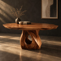 Dining table with a twisted pedestal base and a softly waved edge top, three-quarter view showing the grain