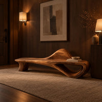 Low bench with a raised wave at one end and an open loop base in an evening entryway with walnut wall paneling