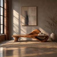 Low bench with a raised wave at one end and an open loop base in an industrial loft entryway with exposed brick