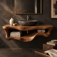 Corner detail of floating bathroom vanity with a thick slab top and a wavy open shelf below beside wood, brass and linen samples