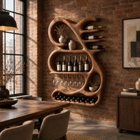 Sculpted wine rack with a looping frame, glass rail and bottle arms in an industrial loft dining room with exposed brick