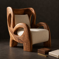 Corner detail of sculpted lounge chair with looping carved arms, cutout back and cream cushions beside wood, brass and linen samples