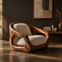 Sculpted wooden lounge chair with open sides and cream seat and back cushions, three-quarter view showing the grain