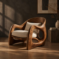 Sculptural wooden chair with looping arms and teardrop side openings, three-quarter view showing the grain