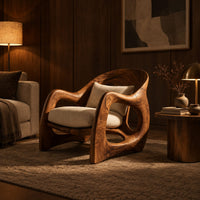 Sculptural wooden chair with looping arms and teardrop side openings in an evening living room with walnut wall paneling