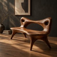 Bench with an open loop backrest and four splayed legs, three-quarter view showing the grain