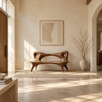 Bench with an open loop backrest and four splayed legs in a bright open plan entryway