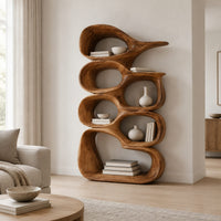 Tall bookshelf made of stacked open wooden cells with a pointed top in a Scandinavian living room with white walls