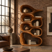 Tall bookshelf made of stacked open wooden cells with a pointed top in an industrial loft living room with exposed brick