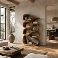 Tall bookshelf made of stacked open wooden cells with a pointed top in a bright open plan living room