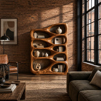 Bookshelf with staggered teardrop openings and sloped top in an industrial loft living room with exposed brick