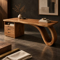 Corner detail of desk with drawer pedestal and curled loop leg beside wood, brass and linen samples