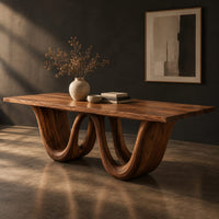 Rectangular dining table on a wavy ribbon base, three-quarter view showing the grain