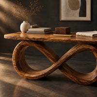 Corner detail of desk with a figure eight loop base and rounded top beside wood, brass and linen samples