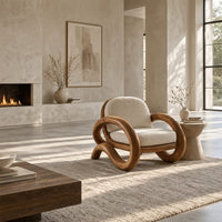 Lounge chair with thick looping arms and curved feet in a bright open plan living room