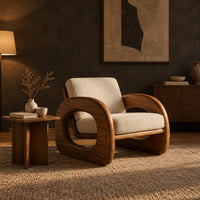 Lounge chair with thick open loop arms and sled base in a dark living room at golden hour
