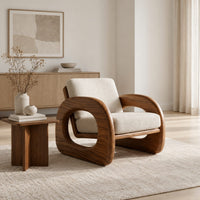 Lounge chair with thick open loop arms and sled base in a Scandinavian living room with white walls
