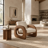 Lounge chair with thick open loop arms and sled base in a bright open plan living room