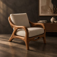Lounge chair with sweeping arms and an oval cutout seat rail, three-quarter view showing the grain