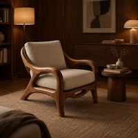 Lounge chair with sweeping arms and an oval cutout seat rail in an evening living room with walnut wall paneling