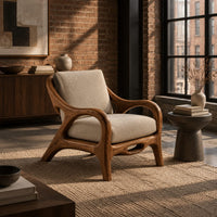 Lounge chair with sweeping arms and an oval cutout seat rail in an industrial loft living room with exposed brick