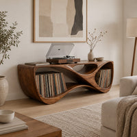 Record console with a twisting looped form and open bays at both ends in a Scandinavian living room with white walls