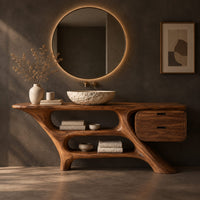 Corner detail of sculptural vanity with slanted legs, two open bays and a drawer box beside wood, brass and linen samples