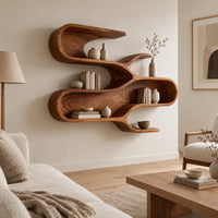 Sculptural wall shelf with three winding open tiers in a Scandinavian living room with white walls