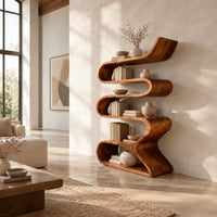 Serpentine bookshelf made from one folding ribbon of wood with open curved shelves in a bright open plan living room