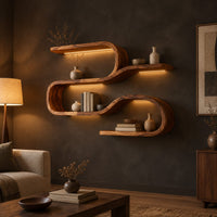 Wavy shelf unit with three flat levels joined by smooth looped bends in a dark living room at golden hour