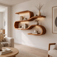 Wavy shelf unit with three flat levels joined by smooth looped bends in a Scandinavian living room with white walls