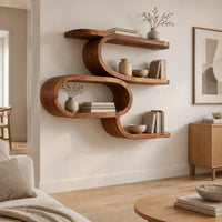 Serpentine wall shelf with an open oval loop in the middle in a Scandinavian living room with white walls